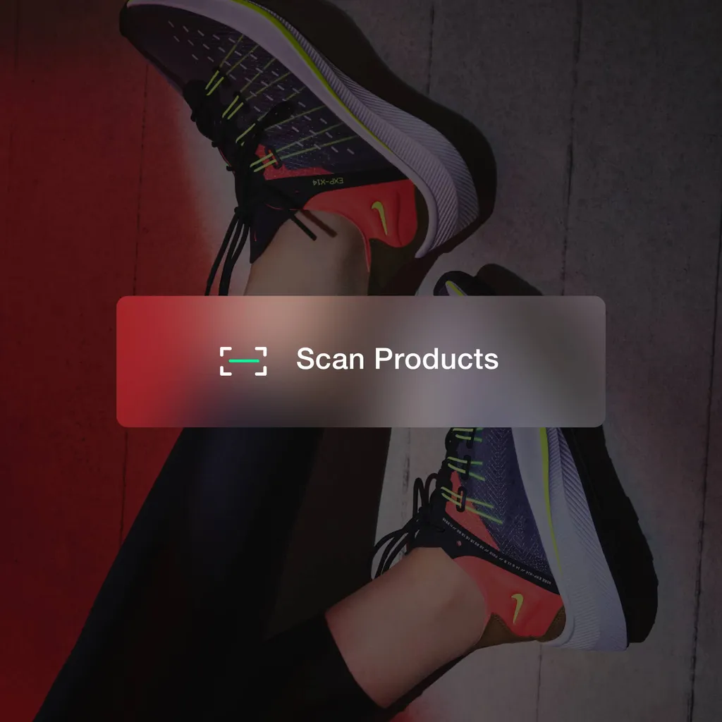 A person raising their legs up in the air wearing Nike sneakers with a Scan Products logo over it. 